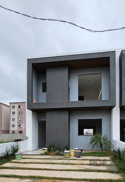 Casa com 120m², 3 dormitórios, 1 suíte, 2 vagas no bairro Hípica em Porto Alegre para Comprar